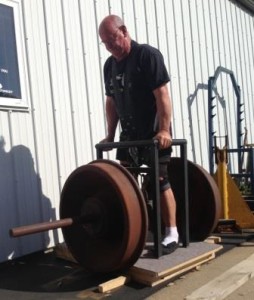 Peter Phillips lifting the 1500 pound challenge train wheels at the Dino Gym.