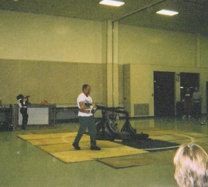 Greg carries the Conan's wheel back in his strongman days at the Shocker Challenge in Salina KS