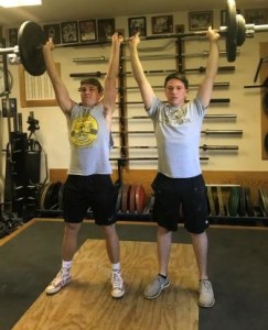 Calvin and Brandon completing a 170 pound Team Middle Finger Clean and Press