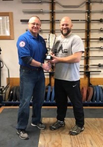 Best Lifter Chad Ullom (right) receiving his award from meet director Al Myers (left).