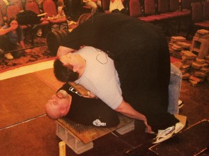 Thom Van Vleck on the bed of nails with 380 pound Terry Lawson on top of hims and 330lb Brian Kerby at the very top.  Yes, it's a physics trick but it still hurts!!!!