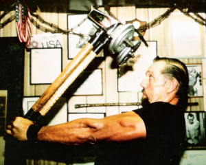 Slim "The Hammer man" Farman doing a sledge hammer leverage exercise with added weight.  