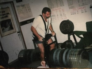 John Carter about to complete his 3,405 pound harness lift. Note the position of his left hand .