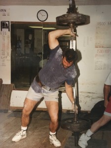 John about to shoulder a 375-pound personal record Steinborn lift. Note the left hand position.