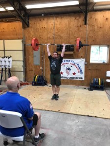 Abe Smith completing the clean and press-heels at Nationals in Al's Dino Gym