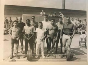 The outside lifters at the 1961 ifting meet in the Leaenworth Federal Prison include the following Columbians: Front row – 2nd thru 5th – Jim McDonald, Art Tarwater, Dave Hahn and Bill Fellows. Back row – far left – Leonard Friesz, third from left – George Comfort